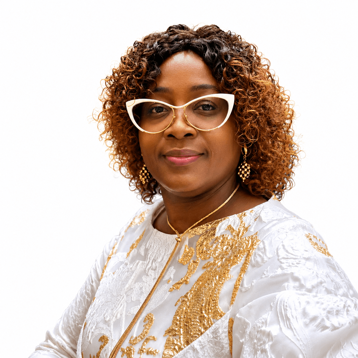 Woman with curly brown hair, white cat-eye glasses, and a gold-patterned white dress.